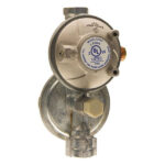 A gas regulator with two valves attached to it.